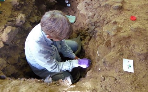 sampling sediments for genetic analysis at Trou Al'Wesse, Belgium